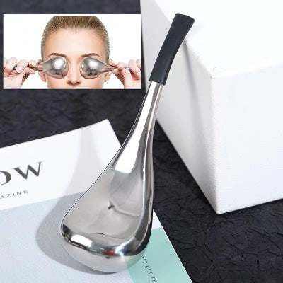 Stainless steel eye massage ice scoop on display, ideal for reducing puffiness and soothing tired eyes.