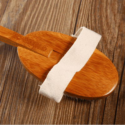 Bamboo removable bath brush with wooden handle and soft bristles.