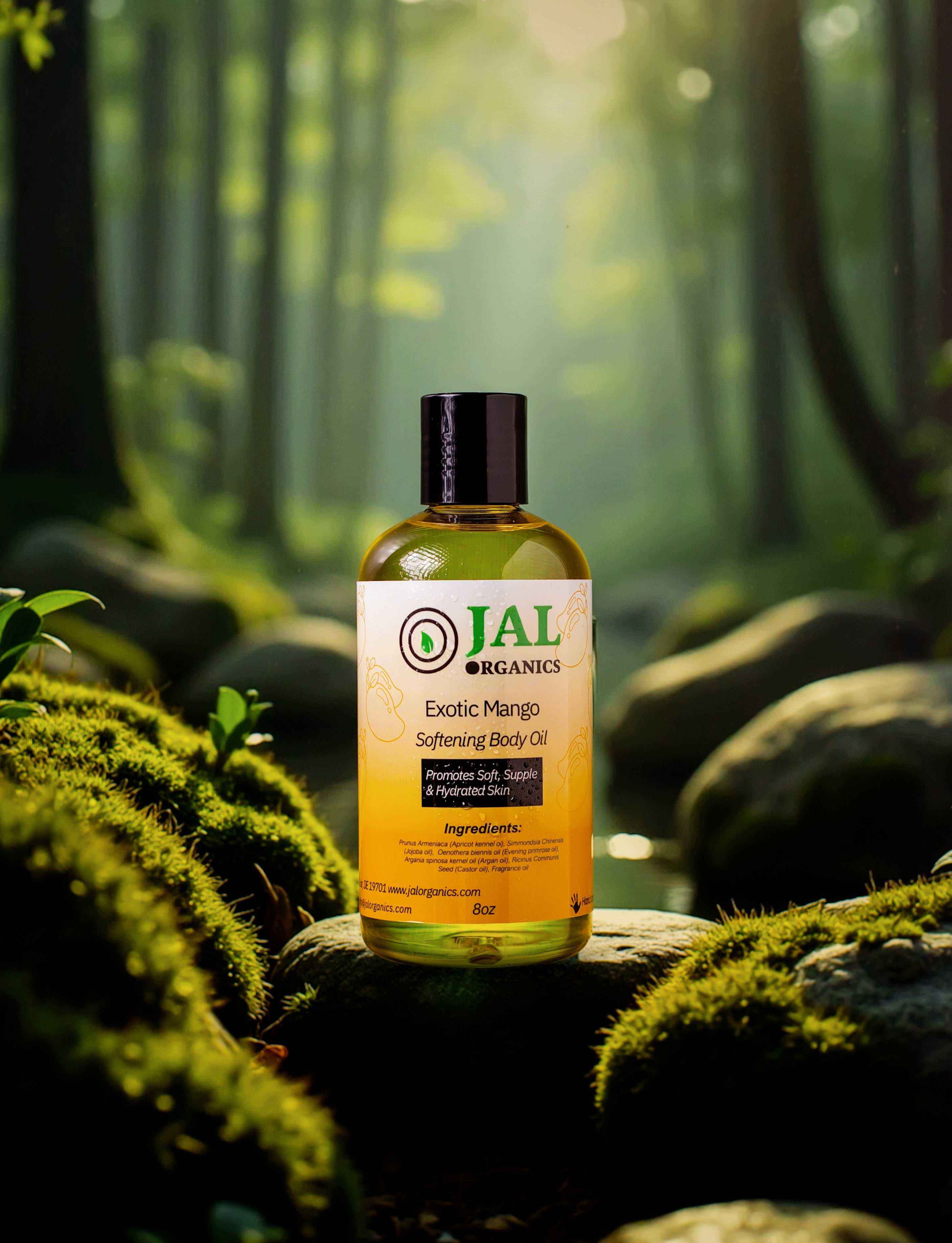 Exotic Mango Body Oil bottle amidst lush forest scenery.