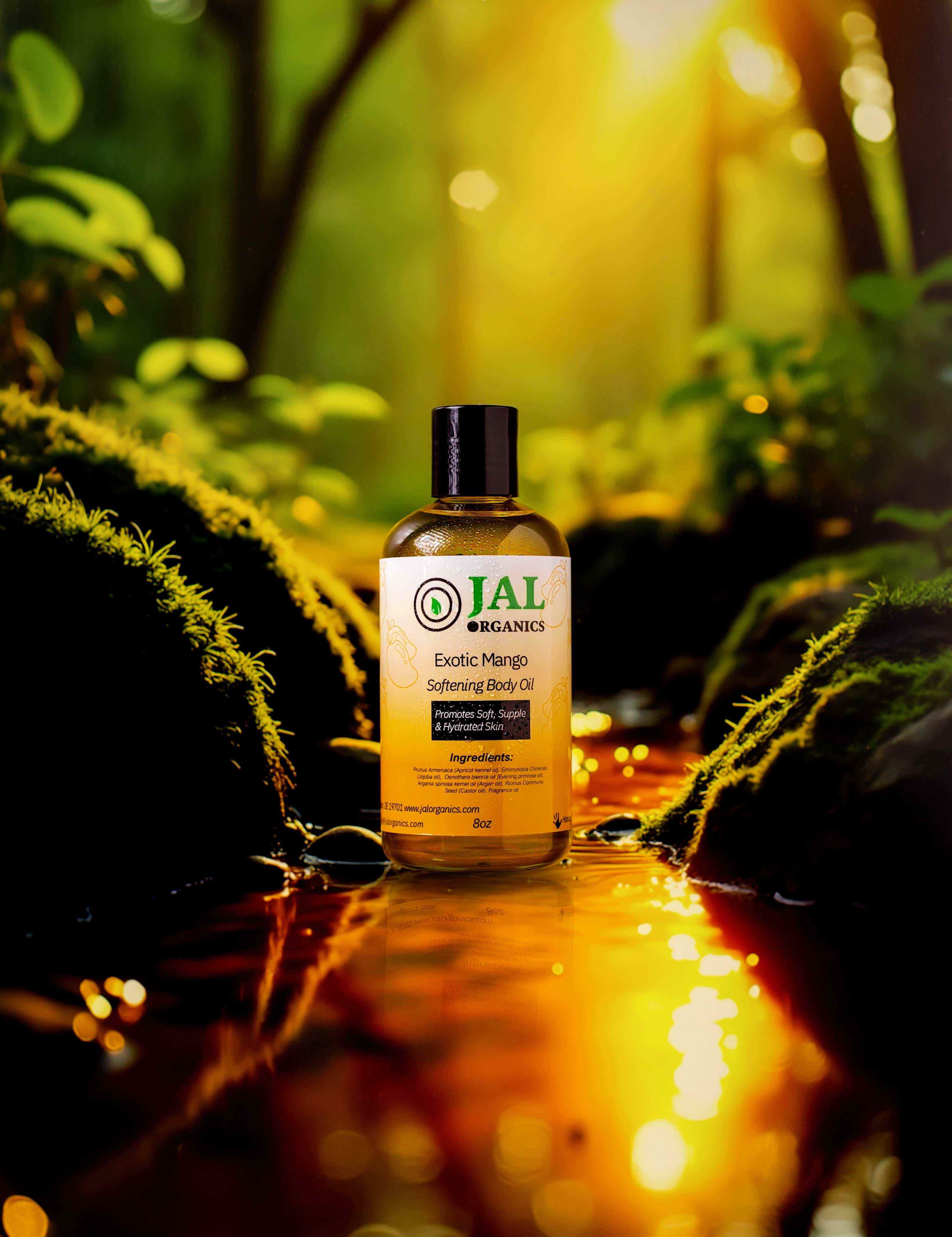 Exotic Mango Body Oil bottle in a vibrant nature setting at sunrise with lush greenery.