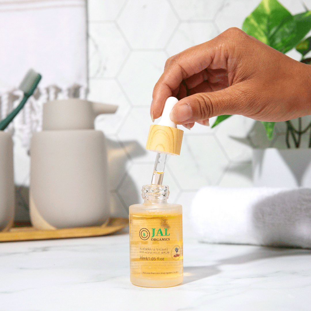 Blueberry and Rhubarb Anti-Aging Serum with dropper bottle in bathroom setting.