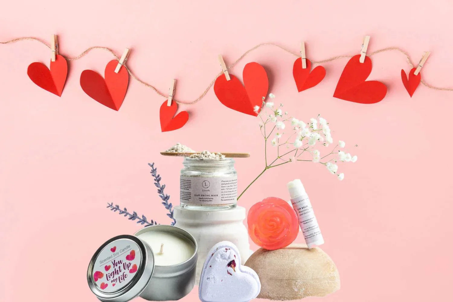 Cherish Skincare Luxury Gift Box for Her with natural lavender spa products including clay facial mask, heart-shaped bath bomb, soy candle, lip balm, soap, and towel with Valentine's Day decor