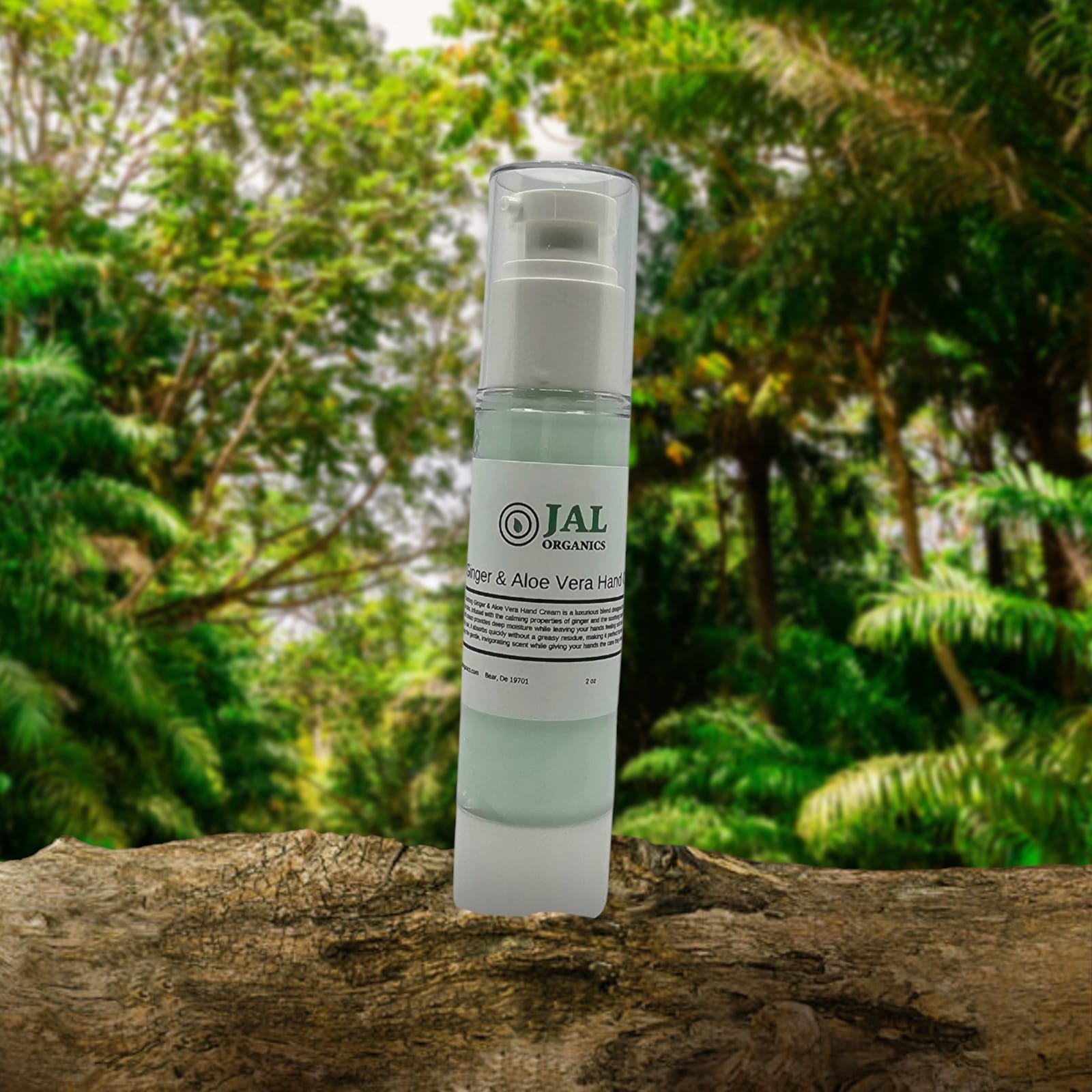 Ginger & Aloe Vera Hand Cream bottle with natural forest background.
