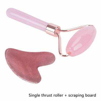 Wrinkle remover Gua Sha stone set with pink resin roller and scraping board for face massage.