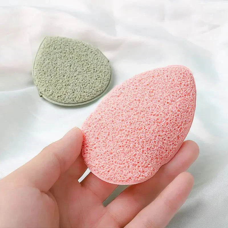 Travel-ready exfoliating face puff in pink and green for gentle facial cleansing and exfoliation.