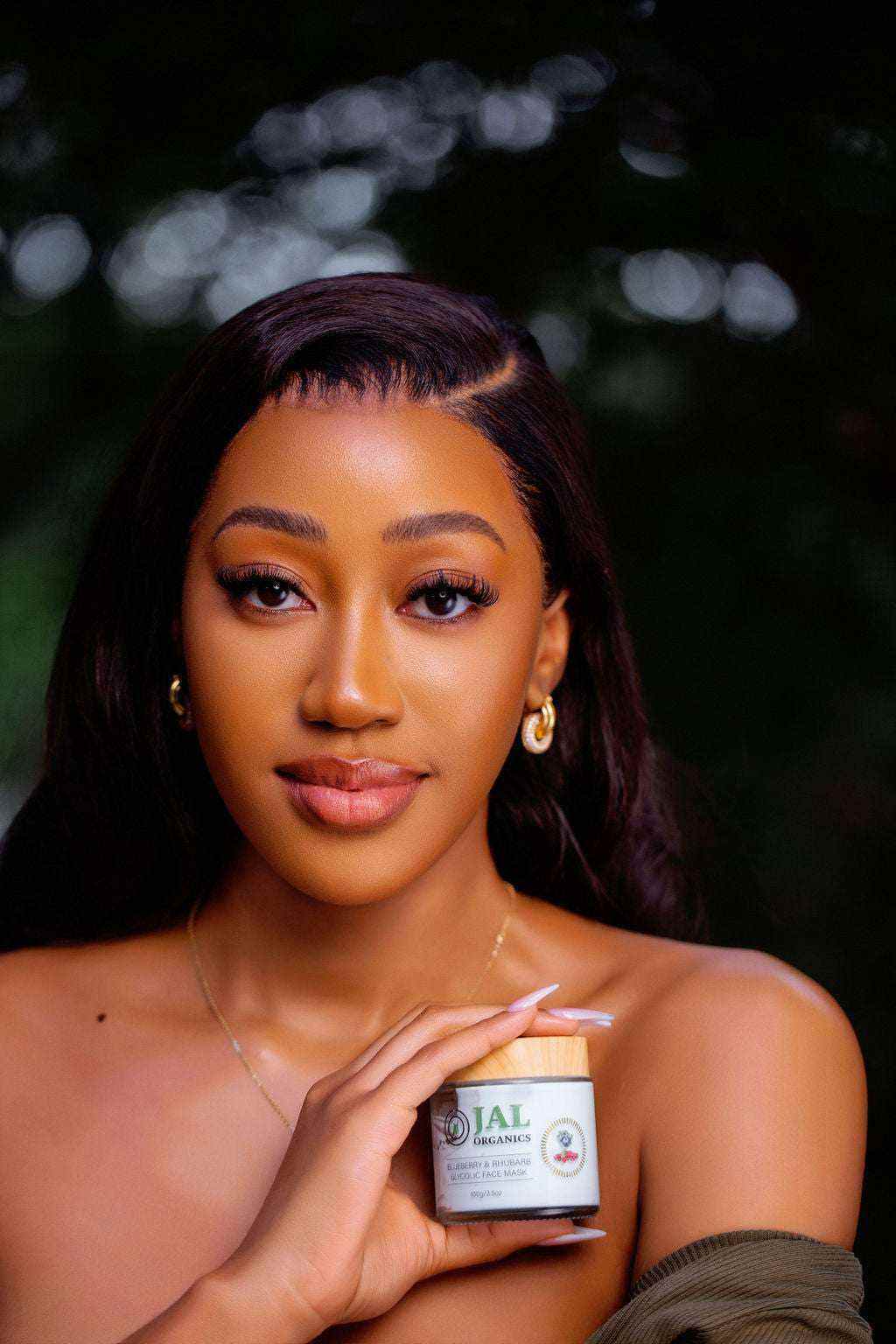 Blueberry Rhubarb Mask in hand, offering exfoliating and hydrating skincare benefits.