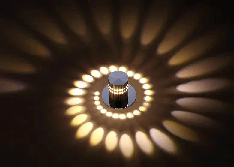 Modern LED Color Changing Wall Light fixture casting decorative circular patterns on wall